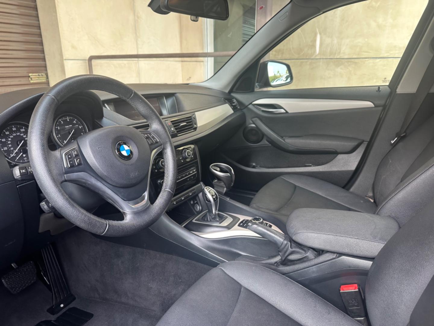 2014 Black /Black BMW X1 (WBAVM1C57EV) with an 4 CYLINDER engine, Automatic transmission, located at 30 S. Berkeley Avenue, Pasadena, CA, 91107, (626) 248-7567, 34.145447, -118.109398 - Photo#9